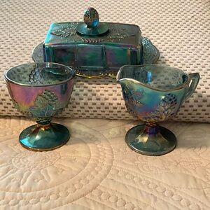 Vintage Carnival glass set of covered butter dish, cream and sugar containers.